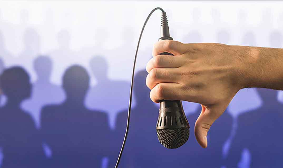 bad-speaker-thumbs-down-microphone-dreamstime_l_103771195-opt